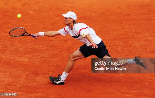 Andreas Seppi of Italy plays a forehand in his men's singles fourth round match against Novak Djokovic of Serbia during day 8 of the French Open at...