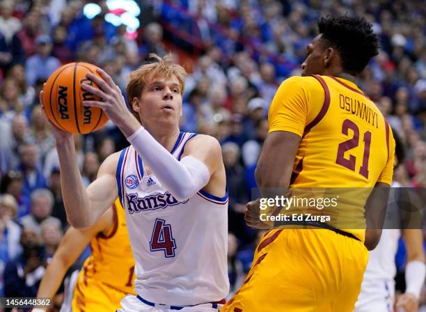 Gradey Dick of the Kansas Jayhawks looks to shoot against Osun Osunniyi of the Iowa State Cyclones in the first half at Allen Fieldhouse on January...