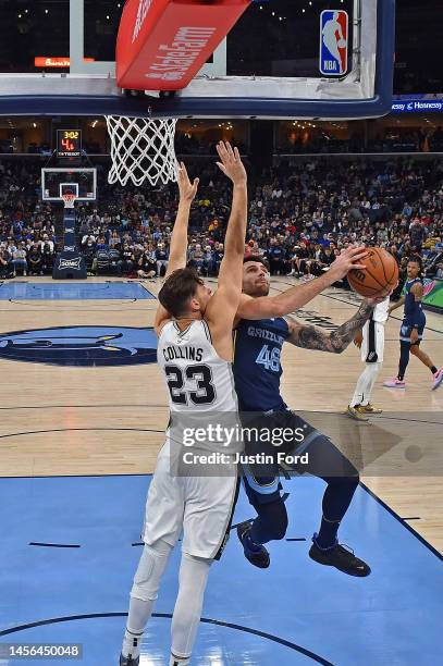 John Konchar of the Memphis Grizzlies goes to the basket during the game against Zach Collins of the San Antonio Spurs at FedExForum on January 11,...