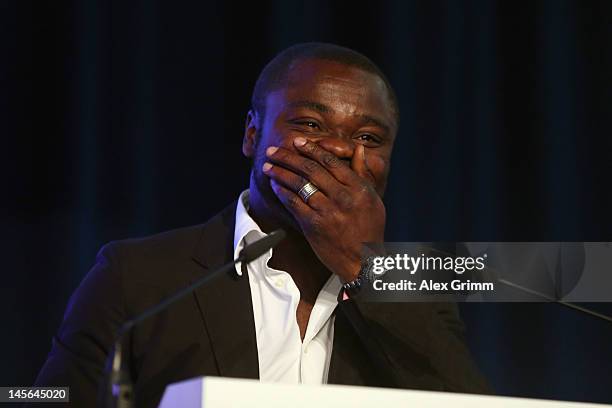 Gerald Asamoah reacts after being awarded member of the Schalke 'Hall of fame' during the annual meeting of FC Schalke 04 at Emscher Lippe Halle on...