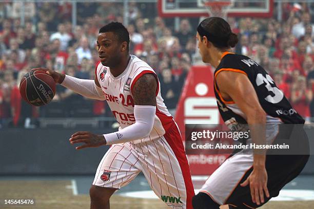 Anthony Leon Tucker of Bamberg shoots against Dane Watts of Ulm during game 1 of the Beko BBL finals between Brose Baskets and ratiopharm Ulm at...