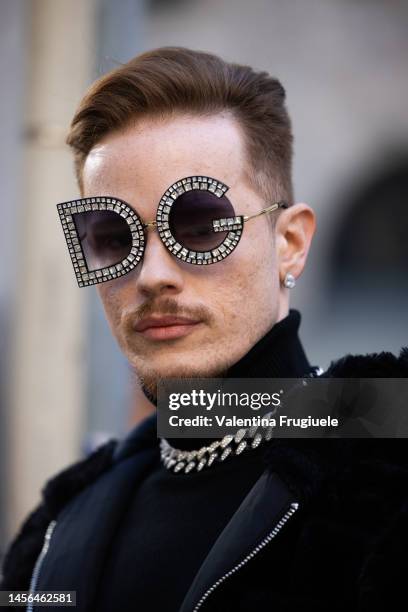 Guest is seen wearing D&G sunglasses outside the Dolce & Gabbana show during the Milan Menswear Fall/Winter 2023/2024 on January 14, 2023 in Milan,...