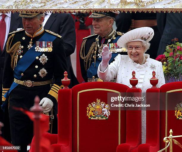 Prince Charles, Prince of Wales, Prince Philip, Duke of Edinburgh and Queen Elizabeth II wave from the Spirit of Chartwell during the Diamond Jubilee...