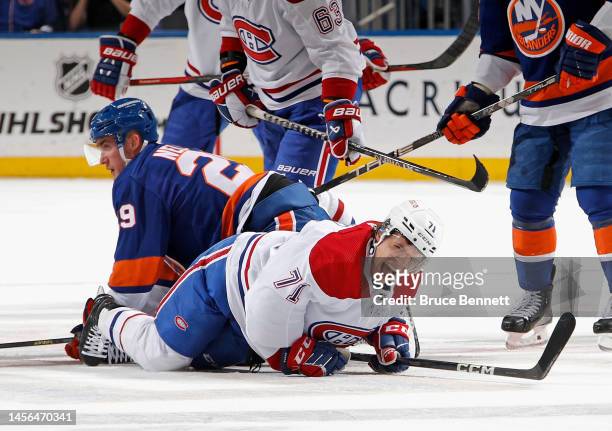 Jake Evans of the Montreal Canadiens is injured on the final faceoff of the first period against Brock Nelson of the New York Islanders at the UBS...