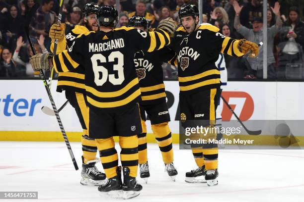 Patrice Bergeron of the Boston Bruins celebrates with Brad Marchand after scoring a goal against the Toronto Maple Leafs during the first period at...