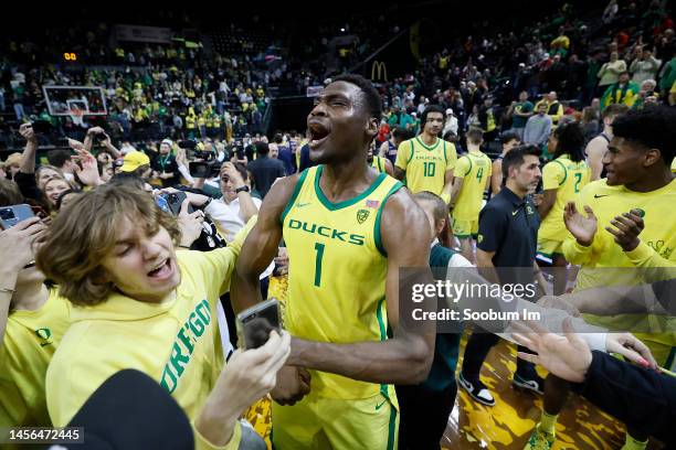 Faly Dante of the Oregon Ducks celebrates with fans after defeating the Arizona Wildcats at Matthew Knight Arena on January 14, 2023 in Eugene,...