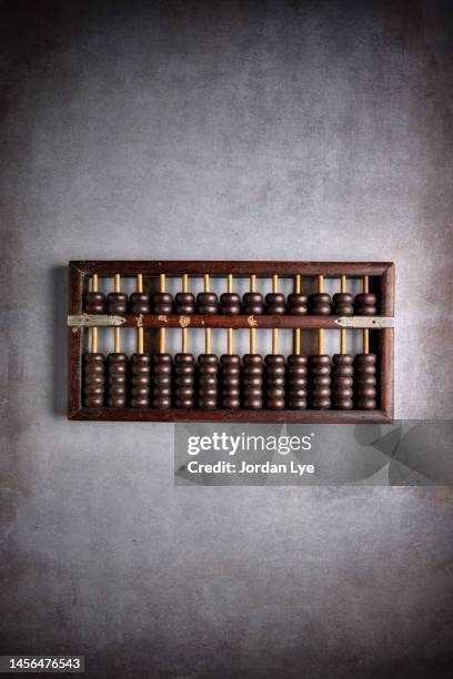 chinese abacus with rustic background - abaco fotografías e imágenes de stock