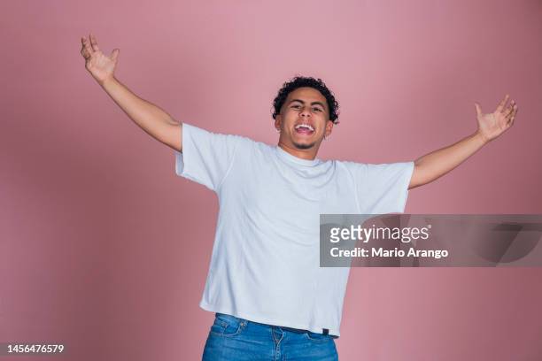 photo of young african man amazed shocked fake novelty rumor news isolated over pastel color background - south american culture stock pictures, royalty-free photos & images