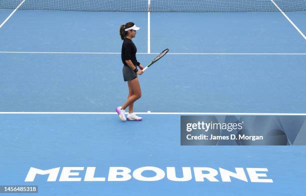 Emma Raducanu of Great Britain walks on court during a practice session ahead of the 2023 Australian Open at Melbourne Park on January 15, 2023 in...