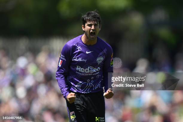 Patrick Dooley of the Hurricanes celebrates the wicket of Daniel Sams of the Thunder during the Men's Big Bash League match between the Hobart...