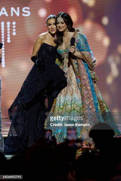 Olivia Culpo and Miss Universe 2021 Harnaaz Sandhu speak during The 71st Miss Universe Competition at New Orleans Morial Convention Center on January...