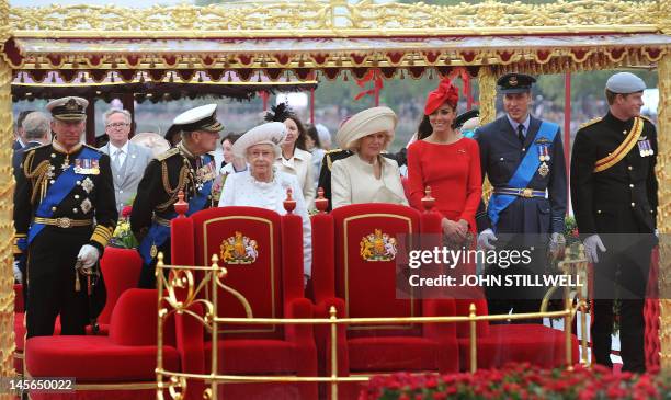 Britain's Queen Elizabeth II stands amid members of the royal family Prince Charles, Prince of Wales, Prince Philip, Duke of Edinburgh, Camilla,...