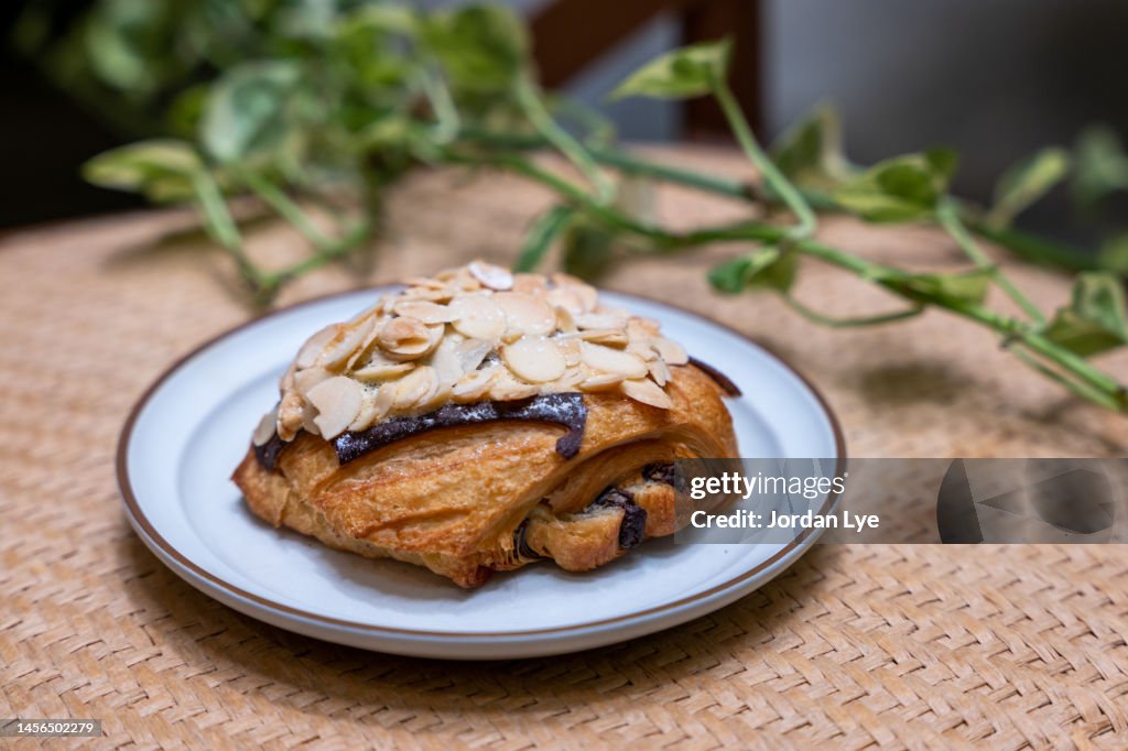 Chocolate almond croissant on plate