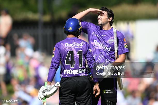 Tim David of the Hurricanes reacts after hitting a six to win the match during the Men's Big Bash League match between the Hobart Hurricanes and the...