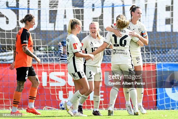 Chelsie Dawber of Adelaide United celebrates with team mates after scoring a goal from a penalty kick during the round 10 A-League Women's match...