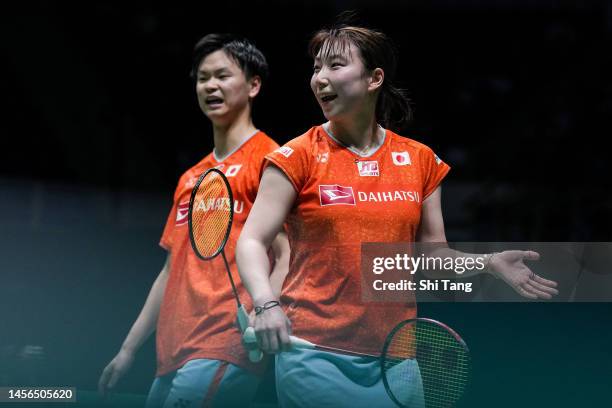 Yuta Watanabe and Arisa Higashino of Japan react in the Mixed Double Final match against Zheng Siwei and Huang Yaqiong of China on day six of...