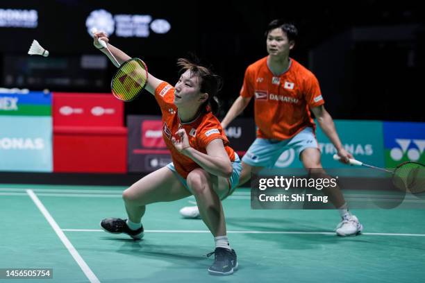 Yuta Watanabe and Arisa Higashino of Japan compete in the Mixed Double Final match against Zheng Siwei and Huang Yaqiong of China on day six of...