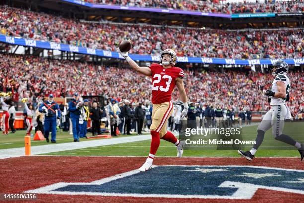 Christian McCaffrey of the San Francisco 49ers celebrates after completing a pass for a touchdown during an NFL football game between the San...