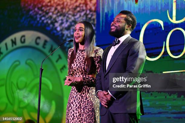 Hosts Michelle Williams and Malcolm-Jamal Warner speak onstage during the 2023 Beloved Community Awards at Hyatt Regency Atlanta on January 14, 2023...