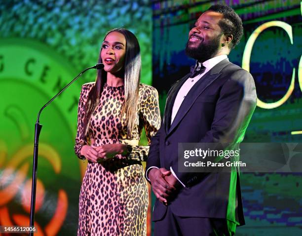 Hosts Michelle Williams and Malcolm-Jamal Warner speak onstage during the 2023 Beloved Community Awards at Hyatt Regency Atlanta on January 14, 2023...