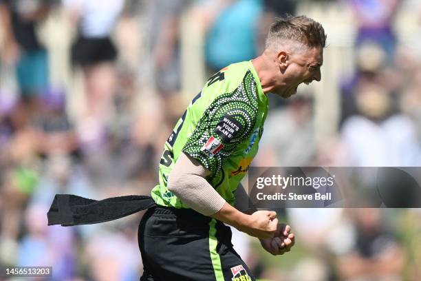 Daniel Sams of the Thunder celebrates the wicket of Caleb Jewell of the Hurricanes during the Men's Big Bash League match between the Hobart...