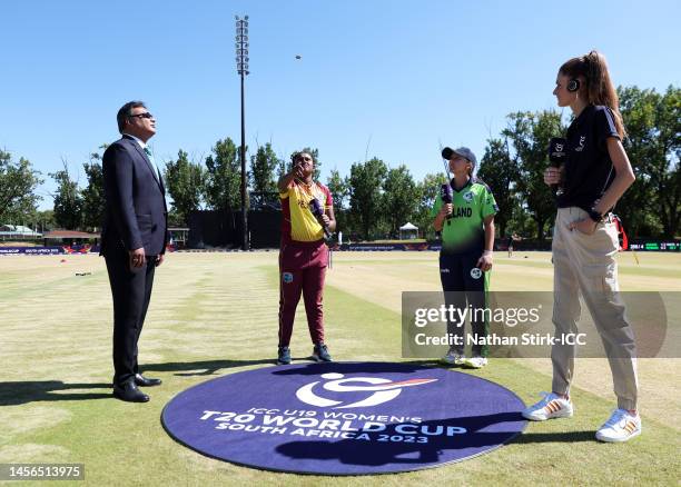 Ashmini Munisar of West Indies flips the coin as Amy Hunter of Ireland looks on ahead of the ICC Women's U19 T20 World Cup 2023 match between West...