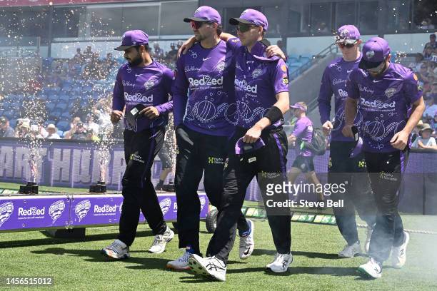 Hurricanes players take the field during the Men's Big Bash League match between the Hobart Hurricanes and the Sydney Thunder at Blundstone Arena, on...