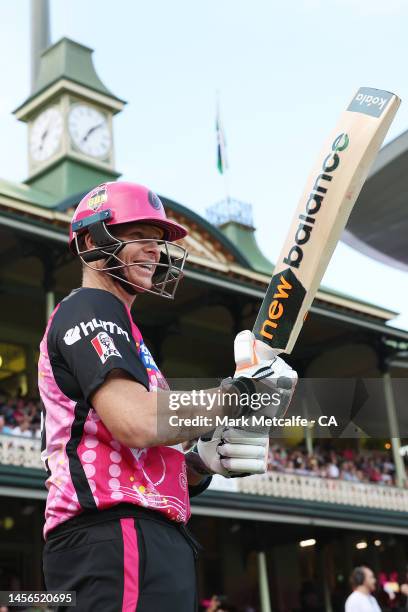 Steve Smith of the Sixers smiles as he chats to indigenous performers before running out to batt during the Men's Big Bash League match between the...