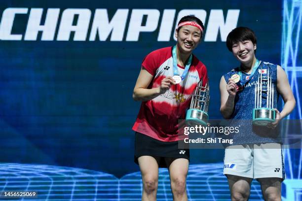 Women's Singles winner Akane Yamaguchi of Japan and runner-up An Se Young of Korea pose with their medals on the podium after the Women's Single...