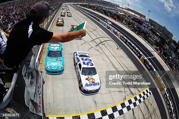 Mark Martin, driver of the Aaron's Dream Machine Toyota, and Jimmie Johnson, driver of the Lowe's Madagascar Chevrolet, lead the field to the green...