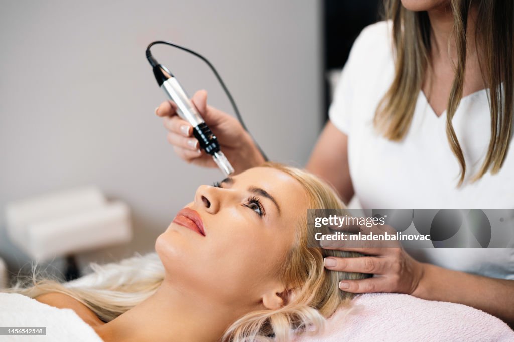Beautiful young woman at beauty clinic