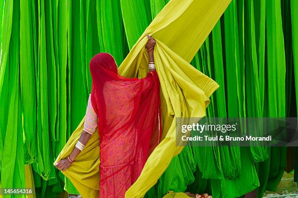 sari factory, rajasthan, india - woman in red sari stock pictures, royalty-free photos & images