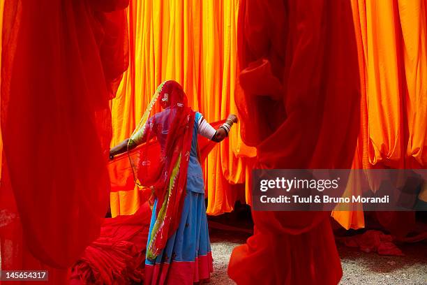 sari factory, rajasthan, india - woman in red sari stock pictures, royalty-free photos & images