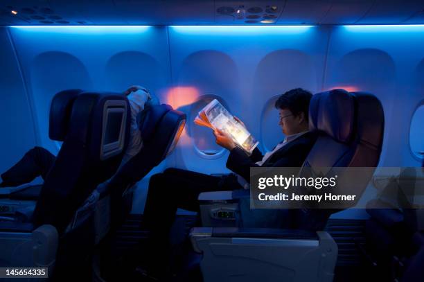 business class air passenger - airplane interior stockfoto's en -beelden