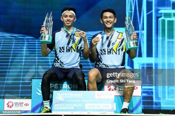 Fajar Alfian and Muhammad Rian Ardianto of Indonesia pose with their medals on the podium after the Men's Double Final match against Liang Weikeng...