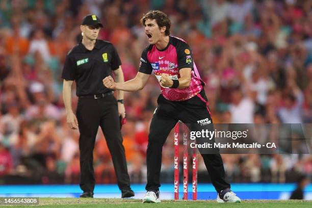 Sean Abbott of the Sixers celebrates taking the wicket of Nick Hobson of the Scorchers during the Men's Big Bash League match between the Sydney...