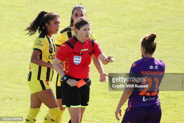 Referee Casey Reibelt shows a red card to Ella Mastrantonio of the Glory during the round 10 A-League Women's match between Perth Glory and...