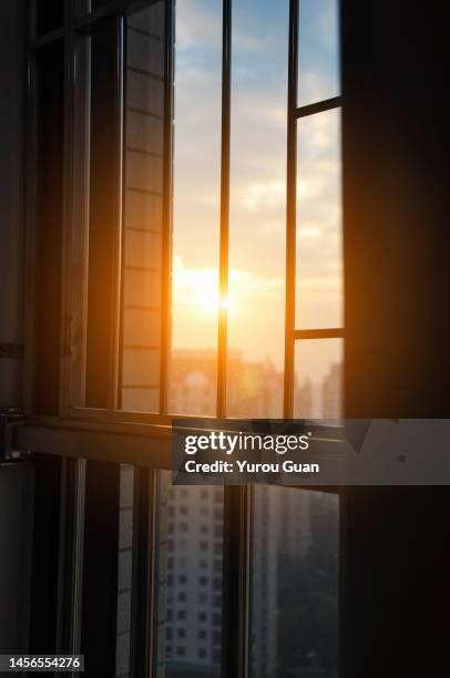 the sun shines into the house through the window in the morning,jiangmen,south china’s guangdong province. - büro und wolke stock-fotos und bilder