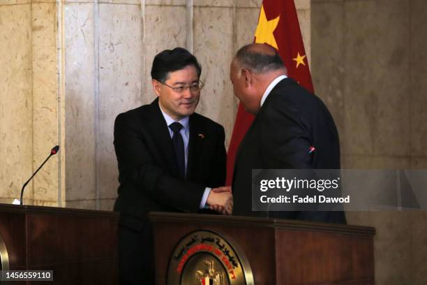 Egyptian Foreign Minister Sameh Shoukry greets his Chinese counterpart Qin Gang after a press conference at the Egyptian Foreign Ministry on January...