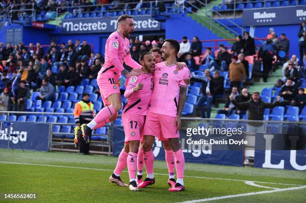 Joselu of RCD Espanyol celebrates with teammates after scoring the team's first goal during the LaLiga Santander match between Getafe CF and RCD...