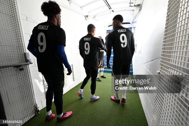 Players of Chelsea FC walk out onto the pitch to warm up while wearing in memory the shirt of former Chelsea player Gianluca Vialli prior during the...