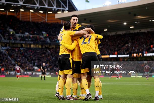 Daniel Podence of Wolverhampton Wanderers celebrates with teammates after scoring his team's first goal during the Premier League match between...