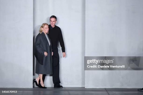 Designer Miuccia Prada and Raf Simons walking the runway at the Prada fashion show during the Milan Menswear Fall/Winter 2023/2024 on January 15,...