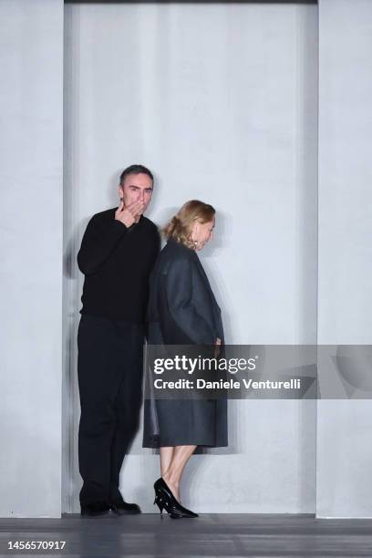 Designer Miuccia Prada and Raf Simons walking the runway at the Prada fashion show during the Milan Menswear Fall/Winter 2023/2024 on January 15,...
