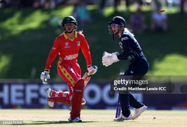 Maddie Ward of England runs out Danielle Meikle of Zimbabwe during the ICC Women's U19 T20 World Cup 2023 match between England and Zimbabwe at JB...