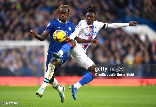 Trevoh Chalobah of Chelsea battles for possession with Eberechi Eze of Crystal Palace during the Premier League match between Chelsea FC and Crystal...