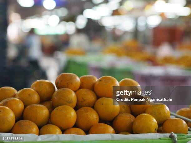orange friut strack in basket - oranges in basket at food market stock pictures, royalty-free photos & images