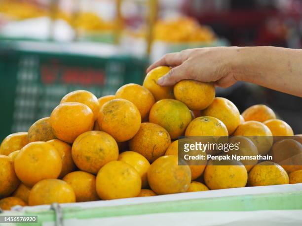 orange friut strack in basket - oranges in basket at food market stock pictures, royalty-free photos & images
