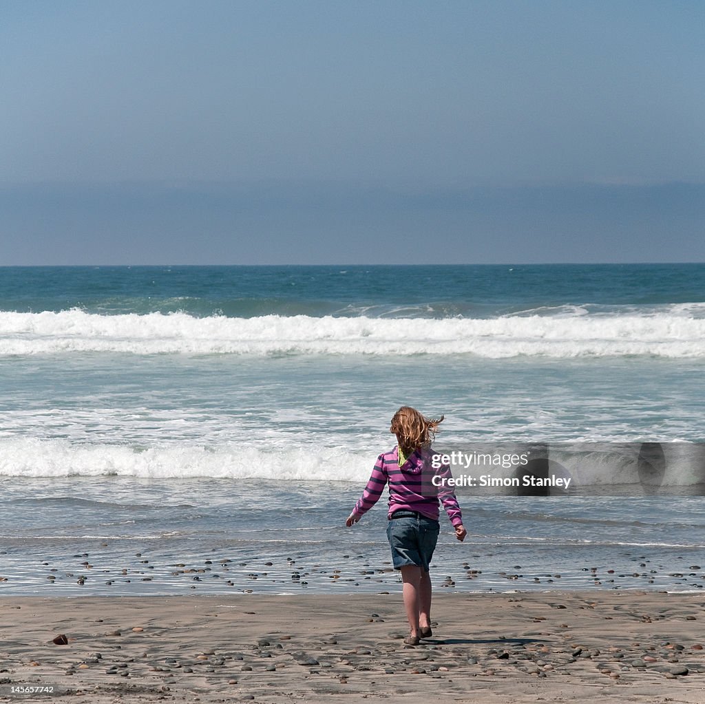 Girl walking on beach