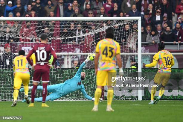 Bala Nzola of Spezia Calcio scores the team's first goal past Vanja Milinkovic-Savic of Torino FC from the penalty spot during the Serie A match...